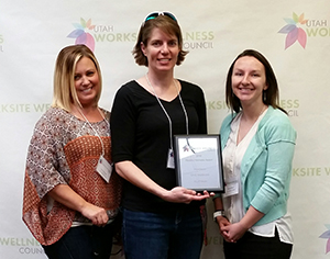 From left: Carrie Concar, Jennifer Homel and Rachel Myrer accept the Healthy Worksite award